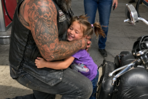 Roadside Bear Hug Reveals A Grieving Father’s Silent Heartbreak